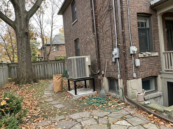 After: Mitsubishi Hyper-Heat outdoor unit beside a Rosedale home