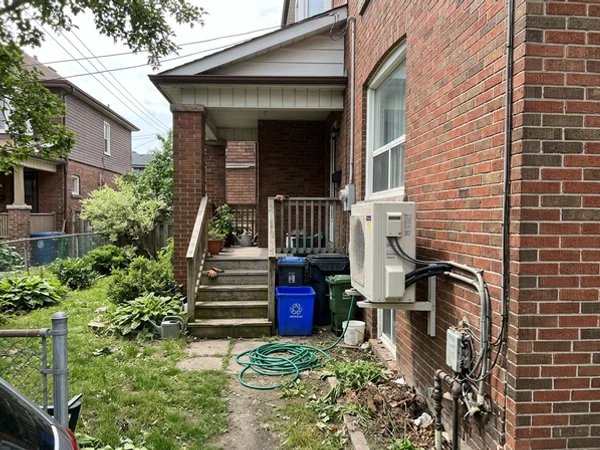 Daikin Fit 3-ton outdoor unit beside a Davisville semi after full-electric conversion