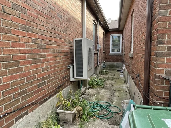 Daikin Fit discharging air along the lot line away from the neighbour's window