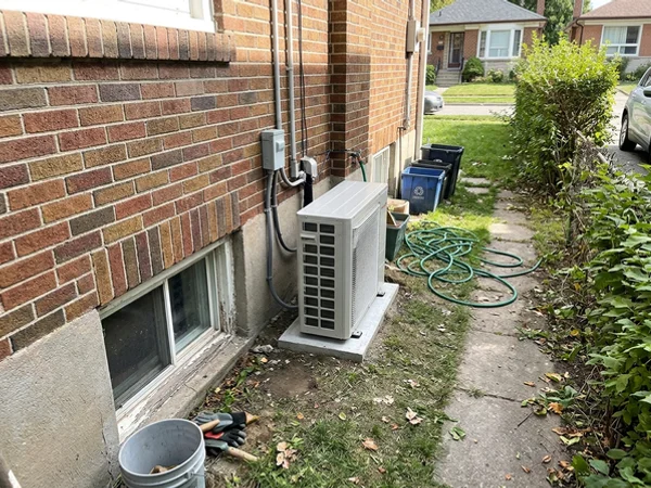 Daikin Fit outdoor unit beside an East York bungalow after full-electric conversion
