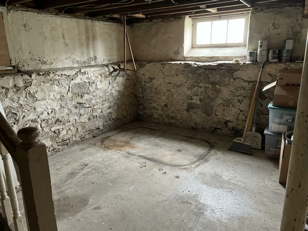 Clean basement corner where the oil tank was removed