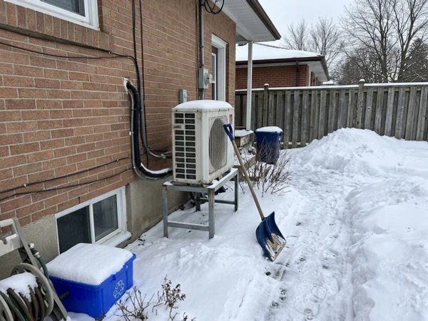 Fujitsu multi-zone outdoor unit behind a Scarborough Village bungalow