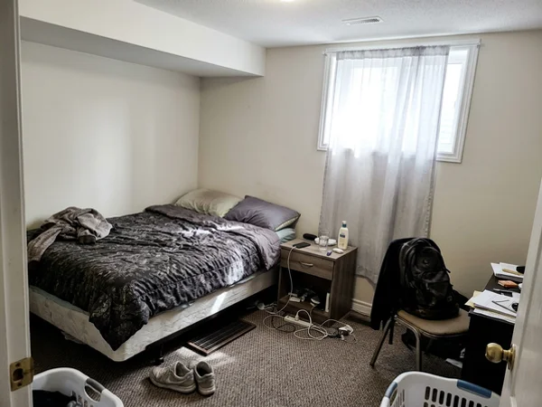 Basement suite bedroom with a supply register from the Gree Flexx system
