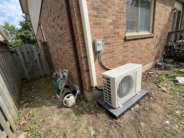 New Fujitsu cold-climate outdoor unit with a new pad and disconnect