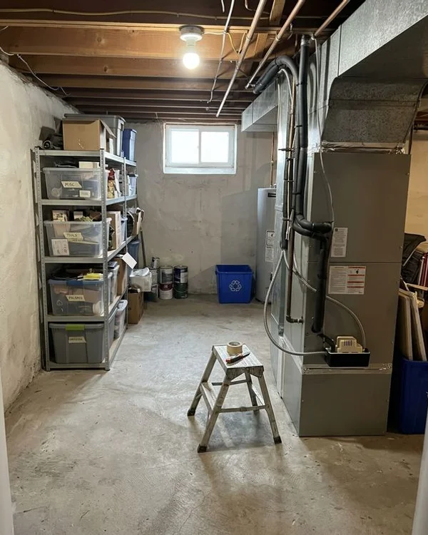New Mitsubishi air handler in the same basement after the cold-climate install