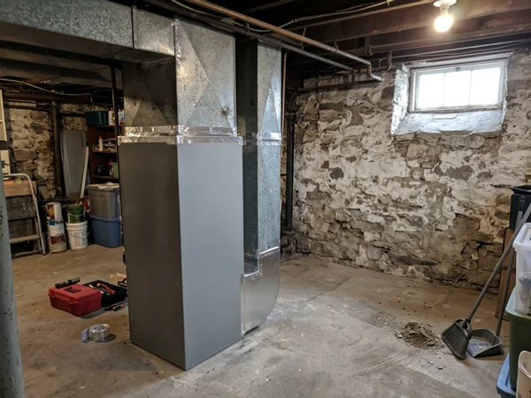 New Mitsubishi air handler on existing ducts after the oil furnace removal