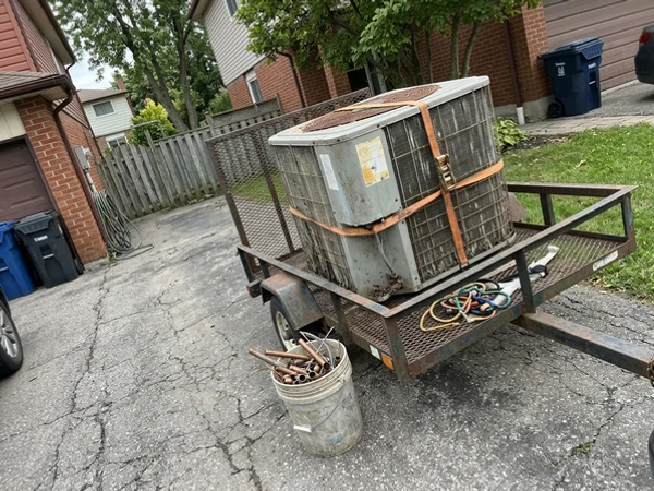 Old 2003 central AC condenser loaded for disposal